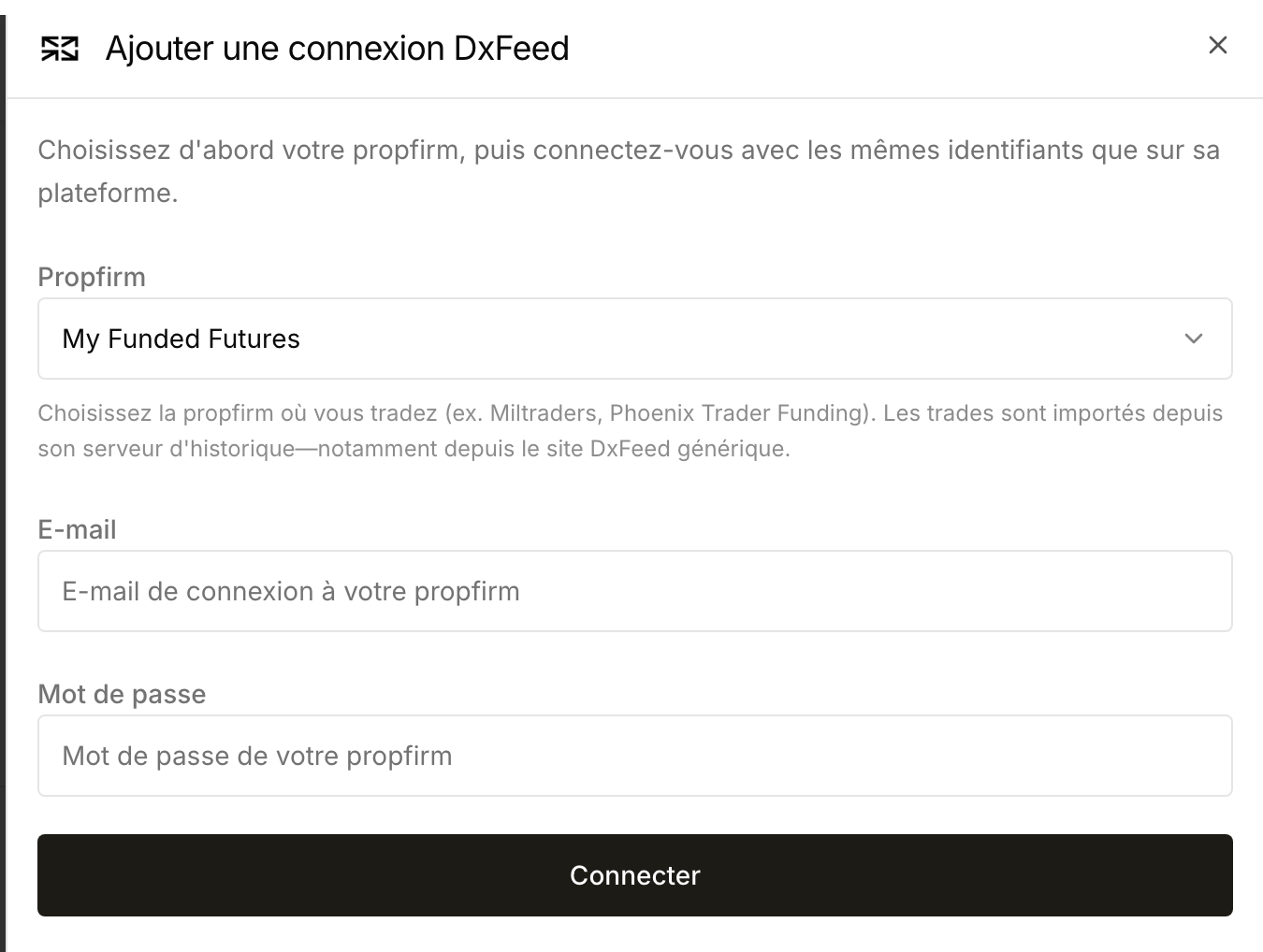 Étape des identifiants DxFeed avec la société sélectionnée et les champs e-mail et mot de passe vides